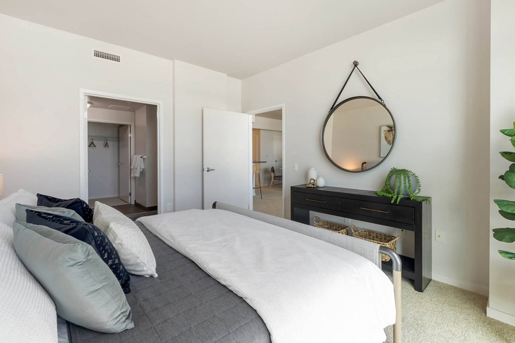 a bedroom with a bed and a mirror above it  at Vue, San Pedro, 90731