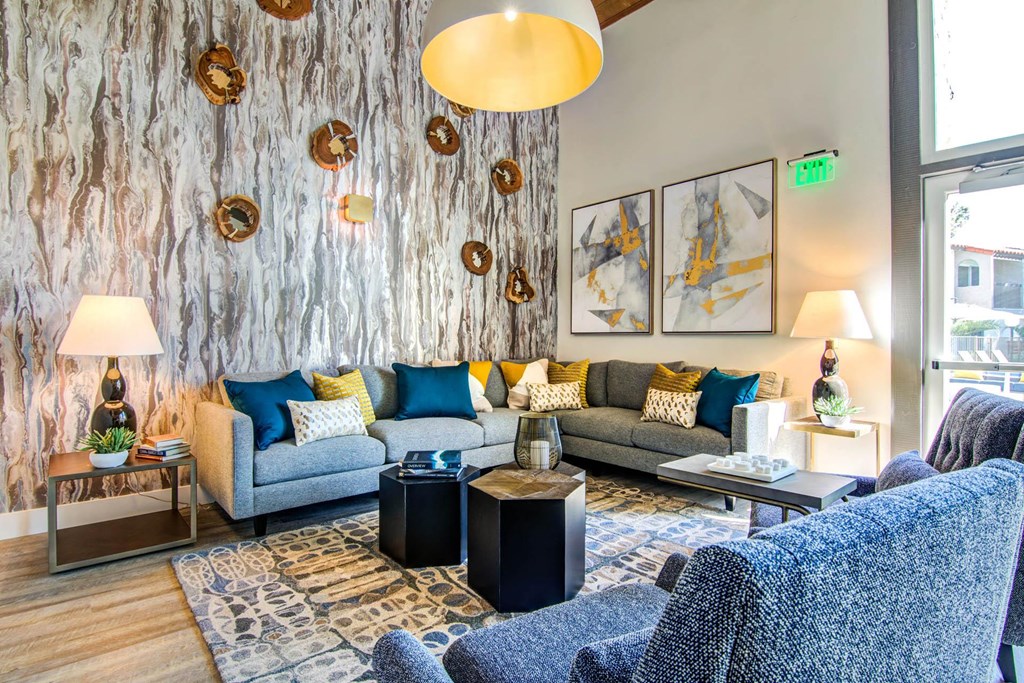 a living room with blue couches and a wall with circles on it  at Veranda La Mesa, California, 91942