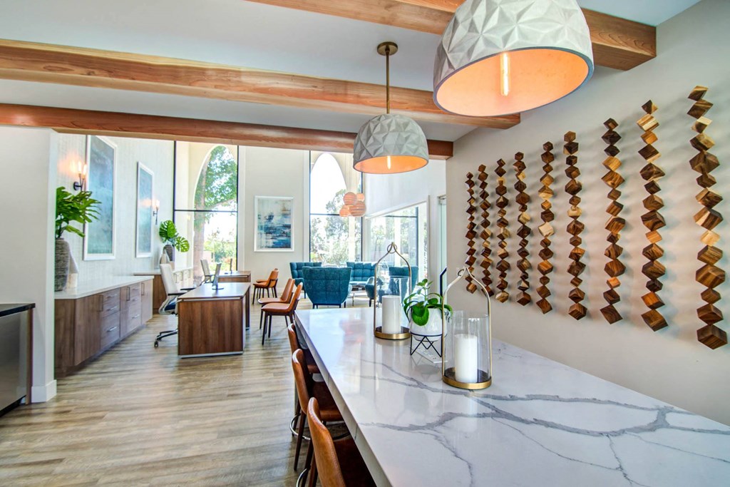 a dining room and living room in a house with a marble counter top  at Veranda La Mesa, California, 91942