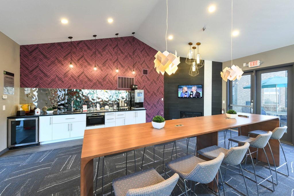 a large kitchen with a wooden table and chairs at Verdant, Boulder, 80303