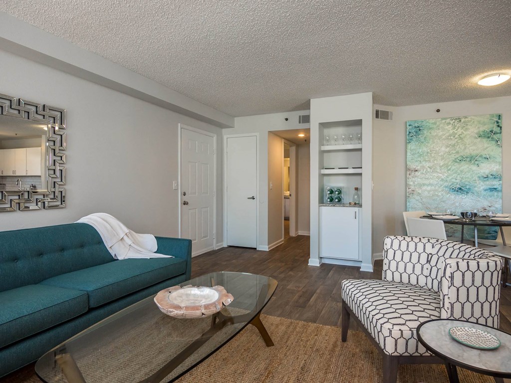 a living room with a blue couch and one chair at Verdant, Boulder, Colorado