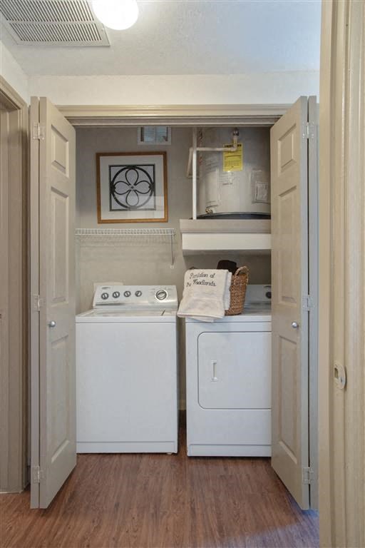 a small laundry room with a washer and dryer