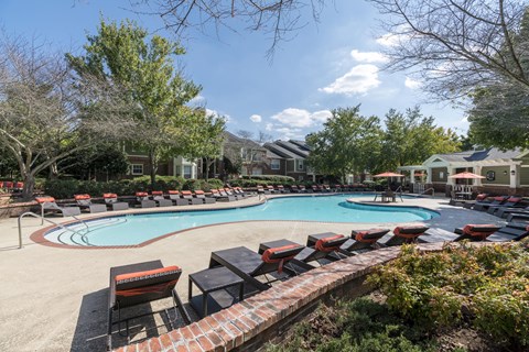 Resort style swimming pool with lounge chairs at Wyndchase Aspen Grove Apartments, Tennessee
