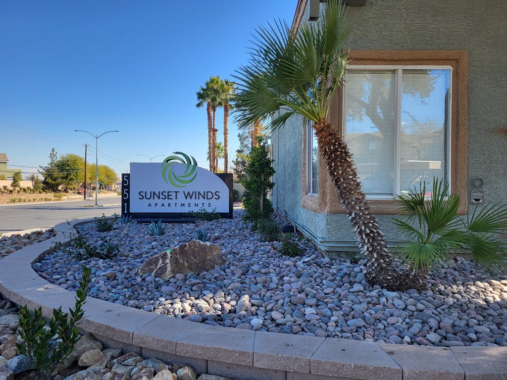 the sign outside of sunset winds guest house at Sunset Winds Apartments in Henderson, Nevada 89014