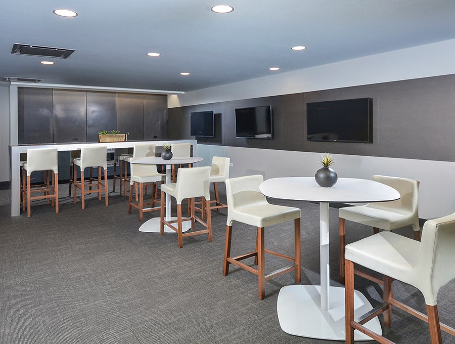 community lounge with tvs | The Montrose Apartments in Chicago, IL