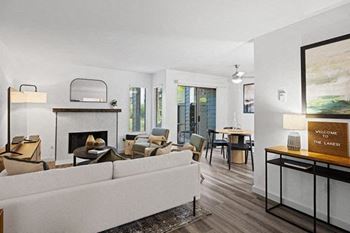 a living room with a white couch and a fireplace at The Lakes in Bellevue, Washington 98007