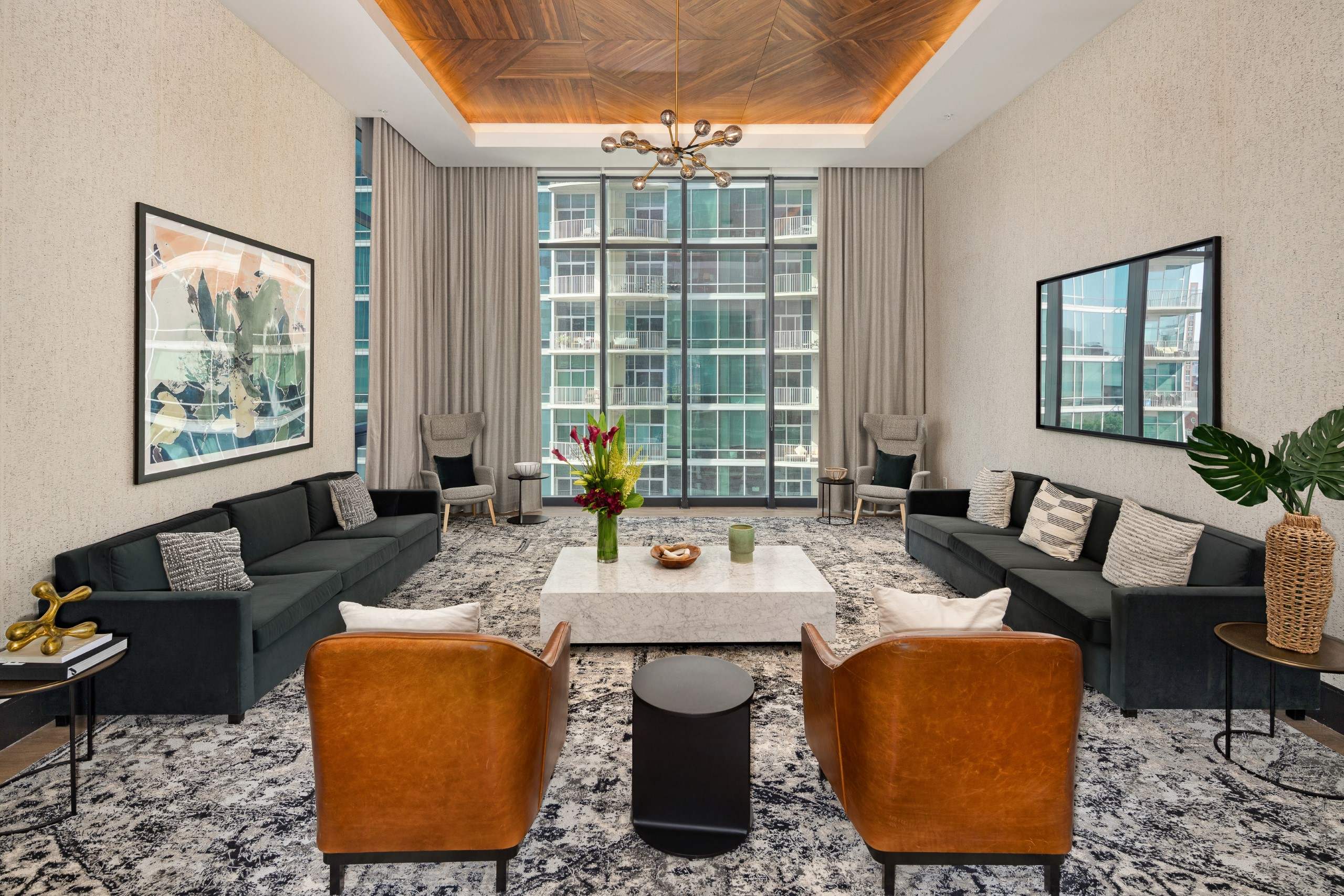 a living room filled with furniture and a large window