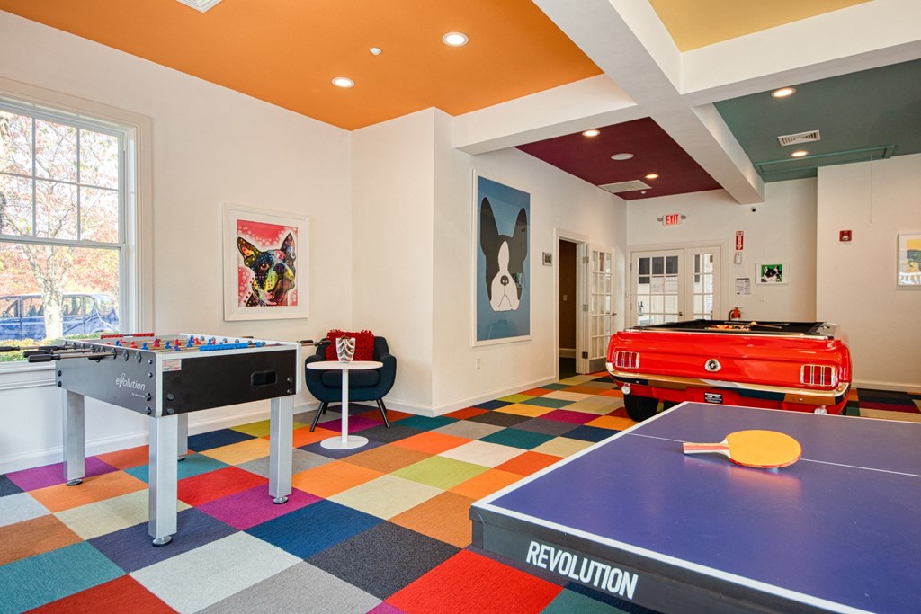 a games room with a pool table and ping pong at Residences at Stevens Pond, Saugus, Massachusetts 01906