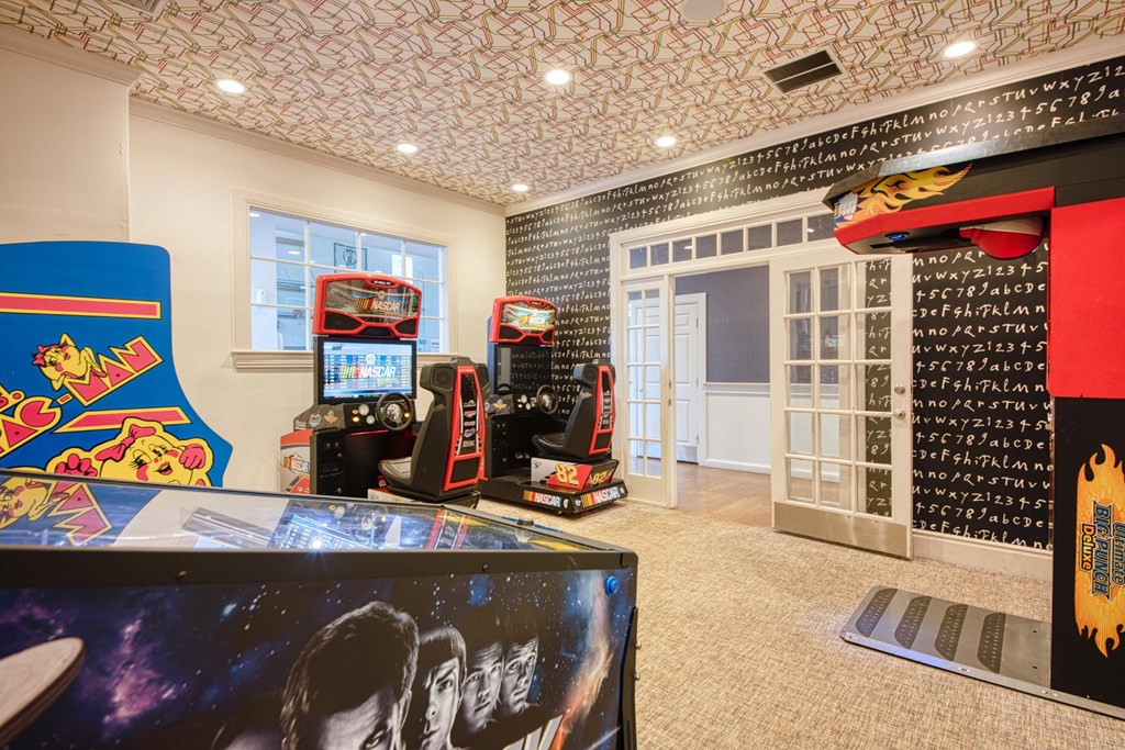 the game room has a lot of video games at Residences at Stevens Pond, Saugus, MA