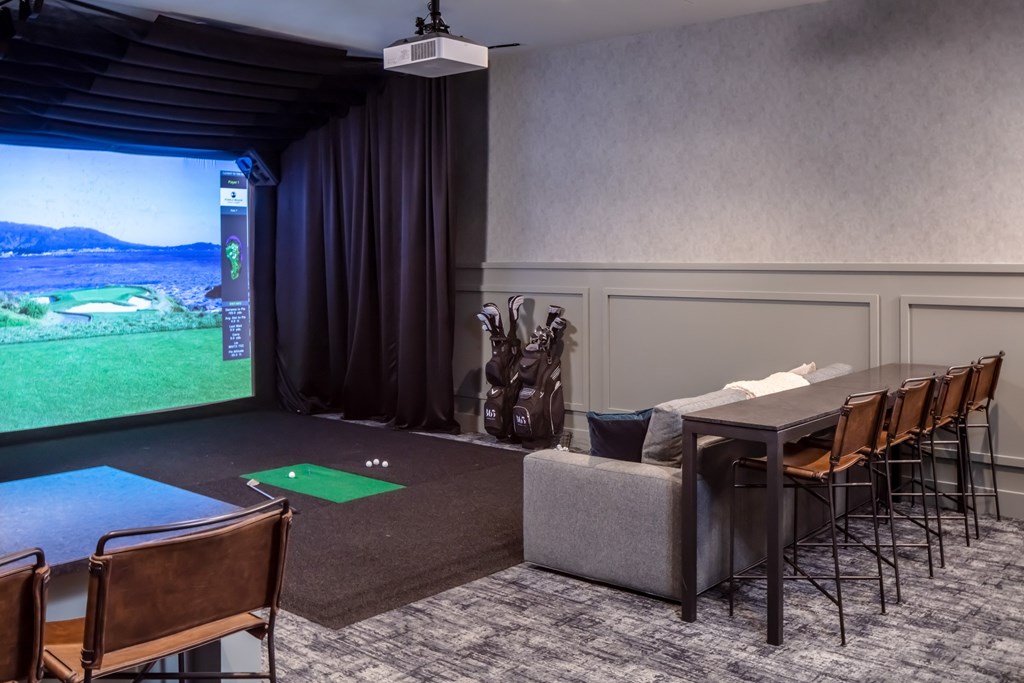 A room with a golf simulator screen at 365 Nicollet, Minneapolis, MN