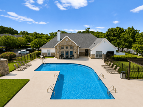 A large house with a pool in the backyard.