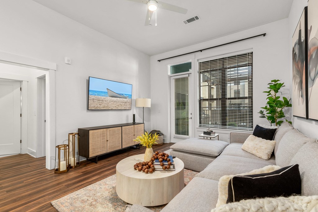 an open living room with a couch and a coffee table at The Colony, North Carolina
