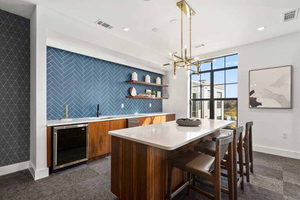 a kitchen with a large island and a dining table with chairs at The Colony, Charlotte, NC, 28211