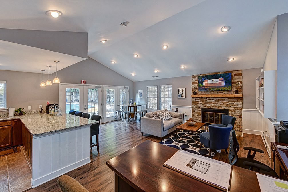 the living room is open to the kitchen and dining room