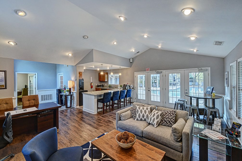 the living room is open to the kitchen and dining area