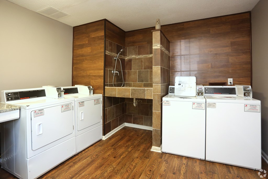 A laundry room with a washer and dryer in it.
