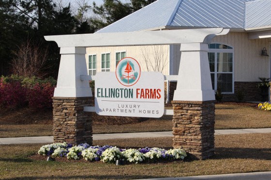 a building with a sign for the ellsworth farms liability partnership house