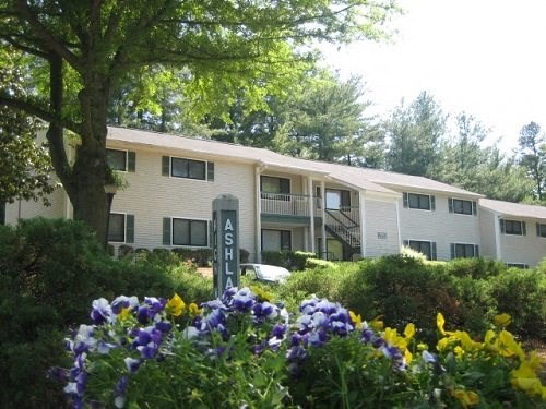a apartment building with flowers in front of it