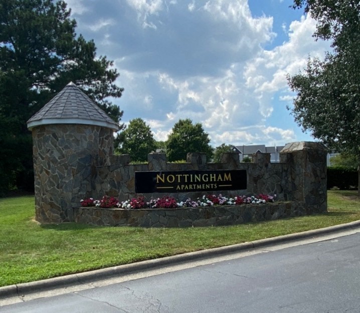 a sign for northingan apartments on the side of a road