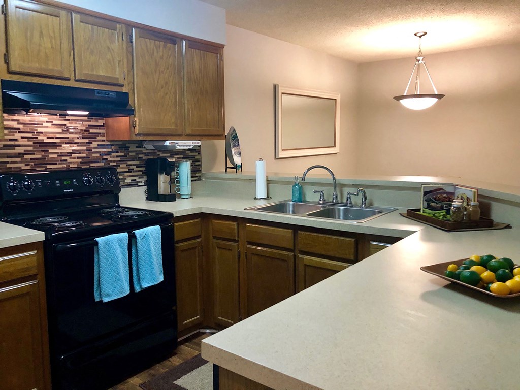 a kitchen with a counter top and a sink