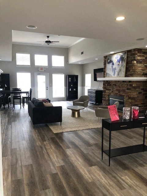 a living room with a brick wall and a fireplace