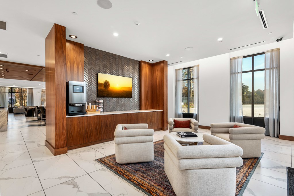 a living room with couches and chairs and a television at The Colony, Charlotte, NC, 28211