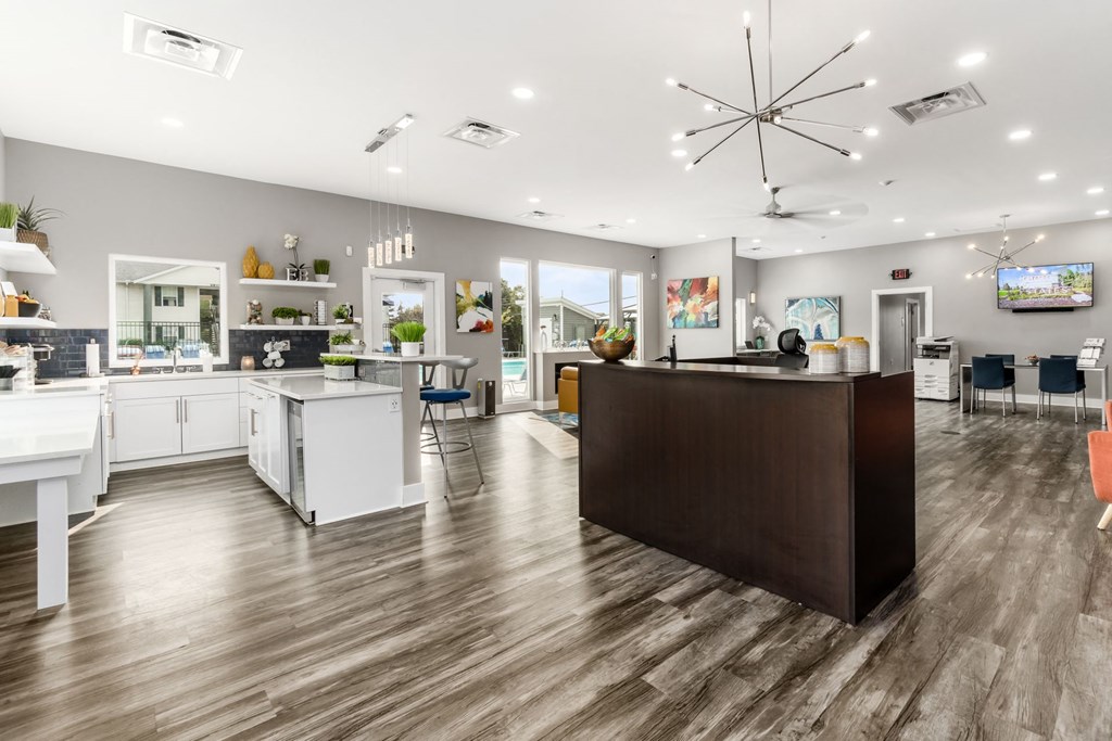 A modern kitchen with a large island and a bar area at Estates at Brentwood Lake Apartments, Ohio, 43068