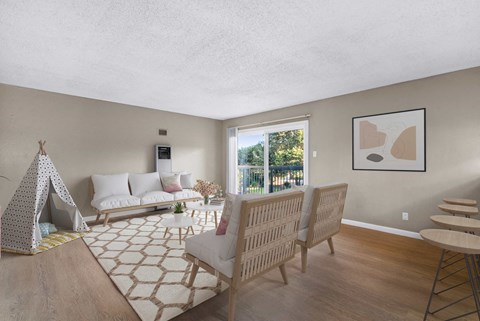 a living room with a couch and chairs and a table