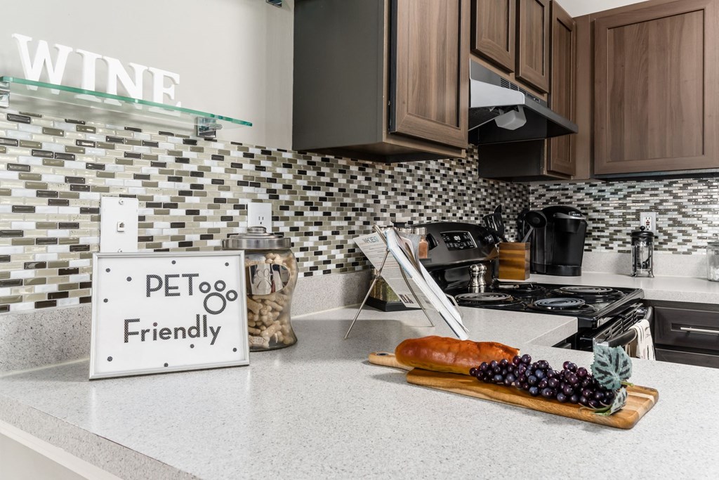 A kitchen counter with a sign that says 