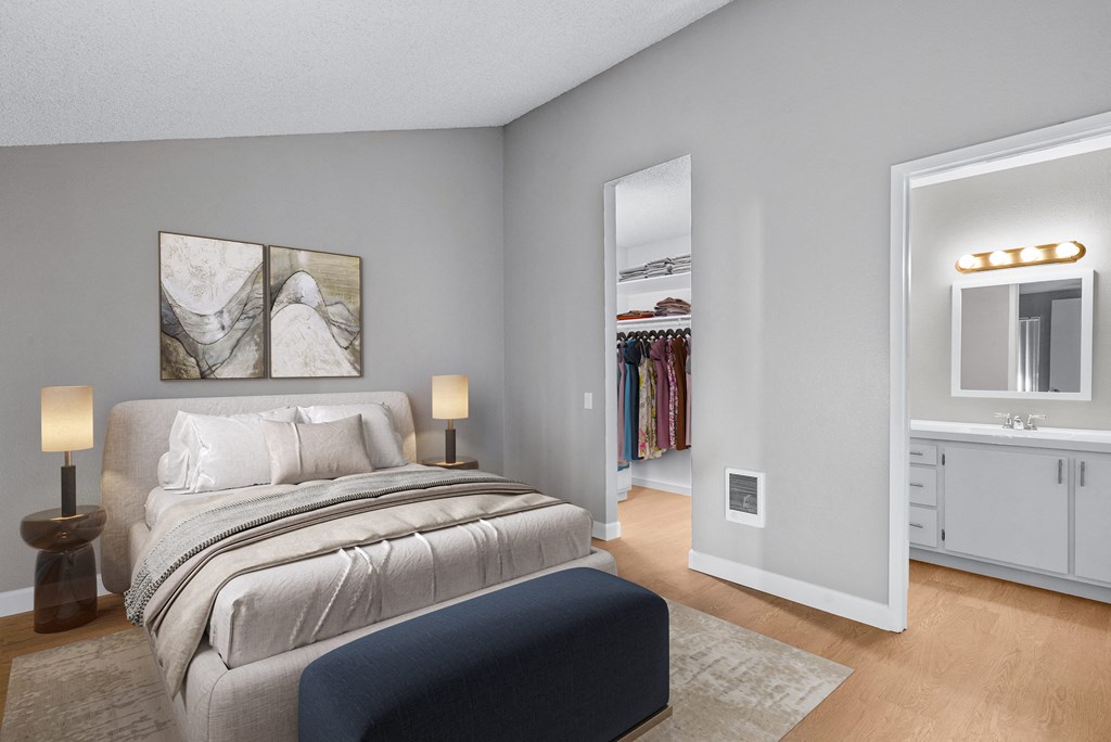 a bedroom with a bed and a closet with a mirror