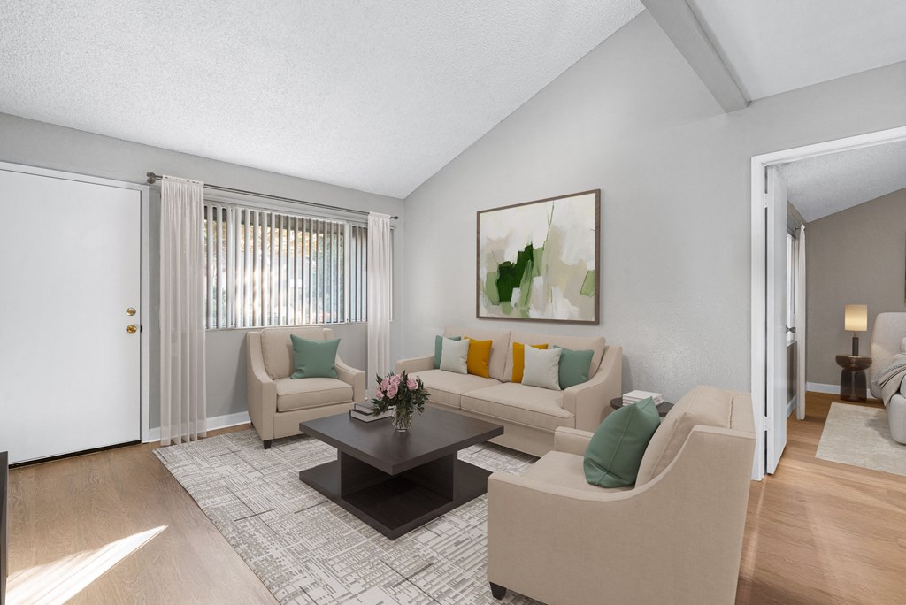 a living room with couches and a coffee table