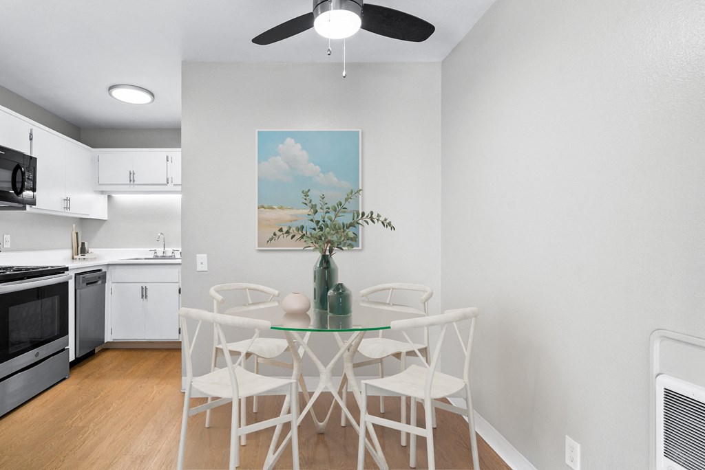 an open kitchen and dining room with a table and chairs