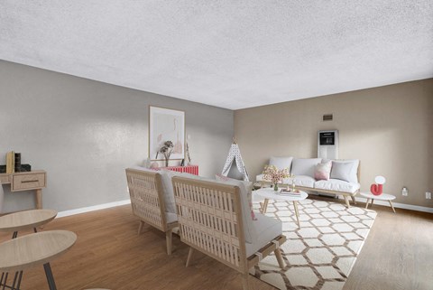 a living room with a couch and chairs and a table