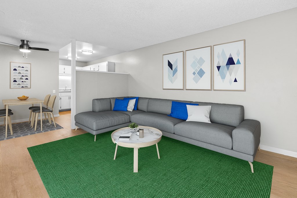 an open living room with a couch and a coffee table