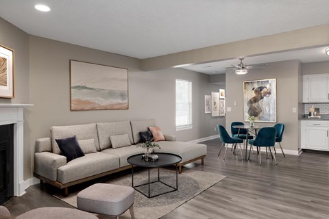 a living room with a couch and a table with chairs