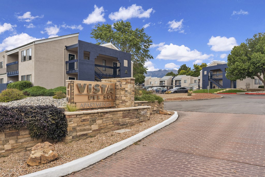 a building with a sign on the side of a road