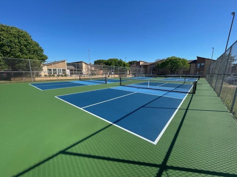 a tennis court with blue and green courts on it