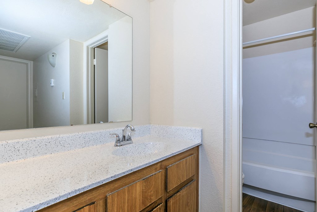 apartment bathroom with sink and mirror at Tides on Southern, Mesa Arizona