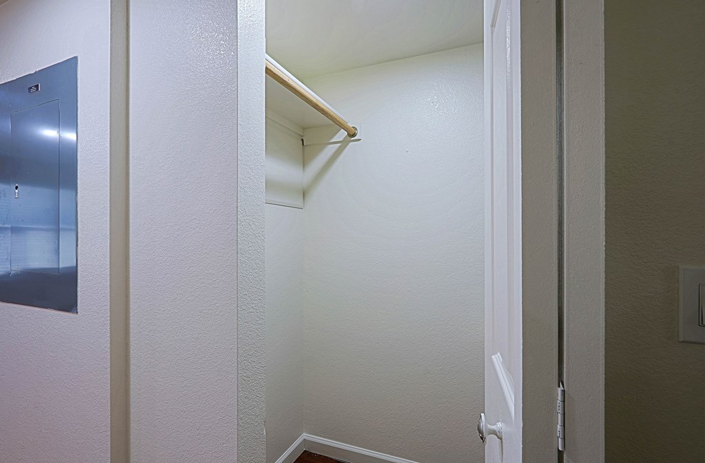 A white door is open to a hallway.
