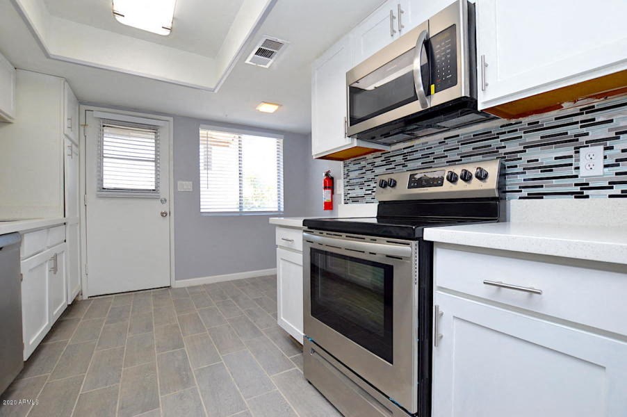 a kitchen with a stove and a microwave