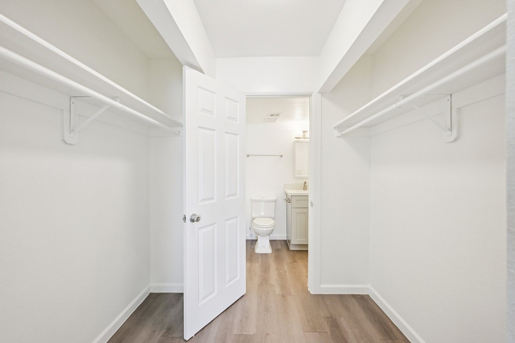 A white door is open to a bathroom.