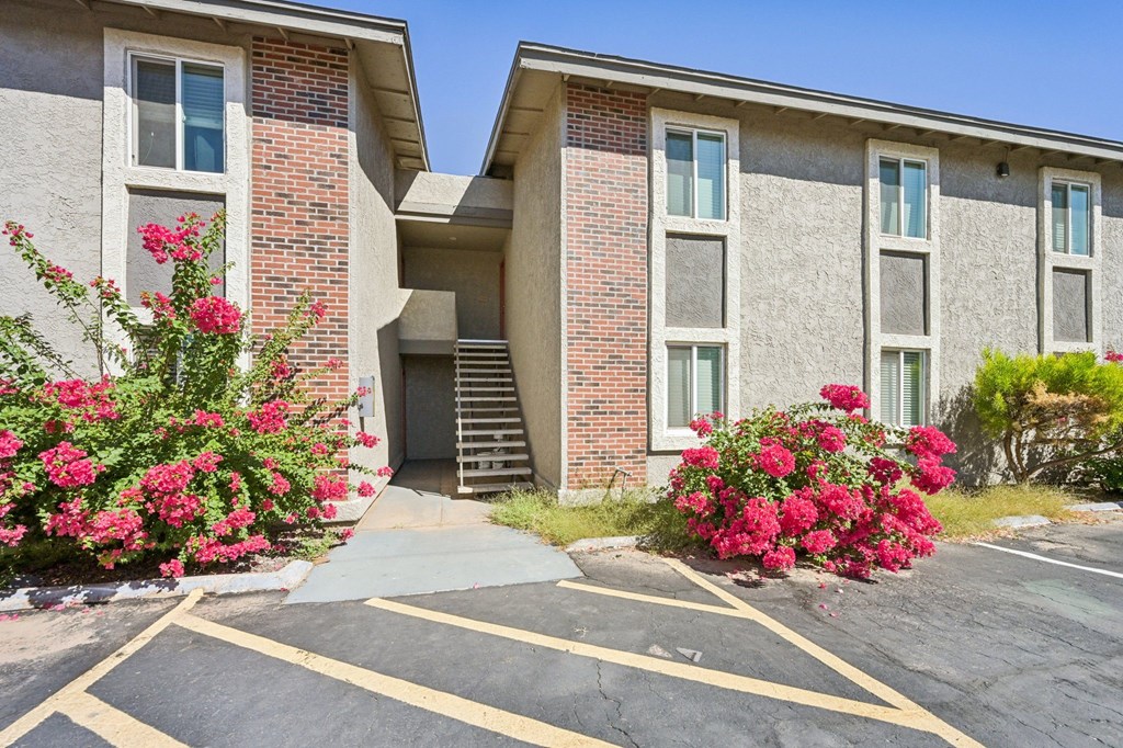 A building with a parking lot in front of it.