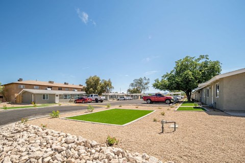 a parking lot with cars in front of a building