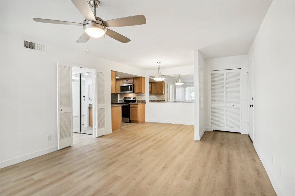 A spacious kitchen with a ceiling fan and wooden floors. at The Viridian Apartments, Scottsdale