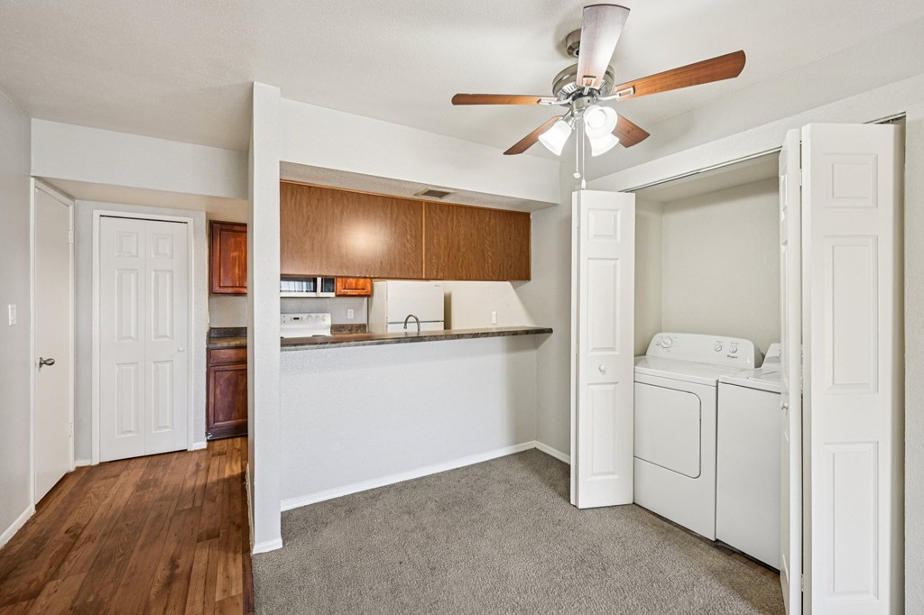 A laundry room with a washer and dryer in it.