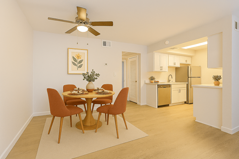A dining room with a table set for four.