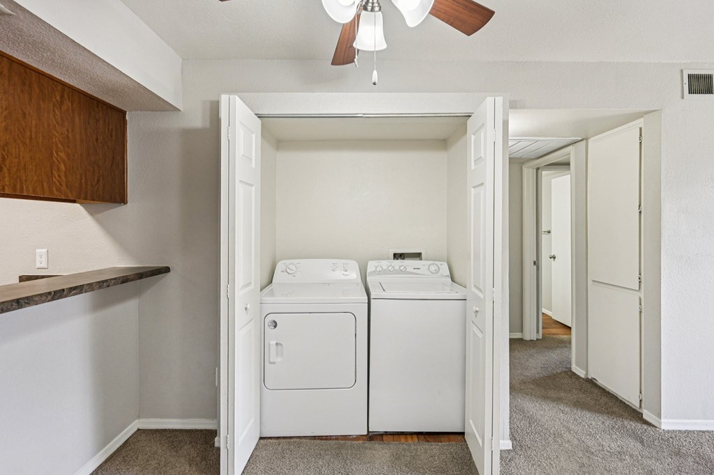 A laundry room with a washer and dryer.