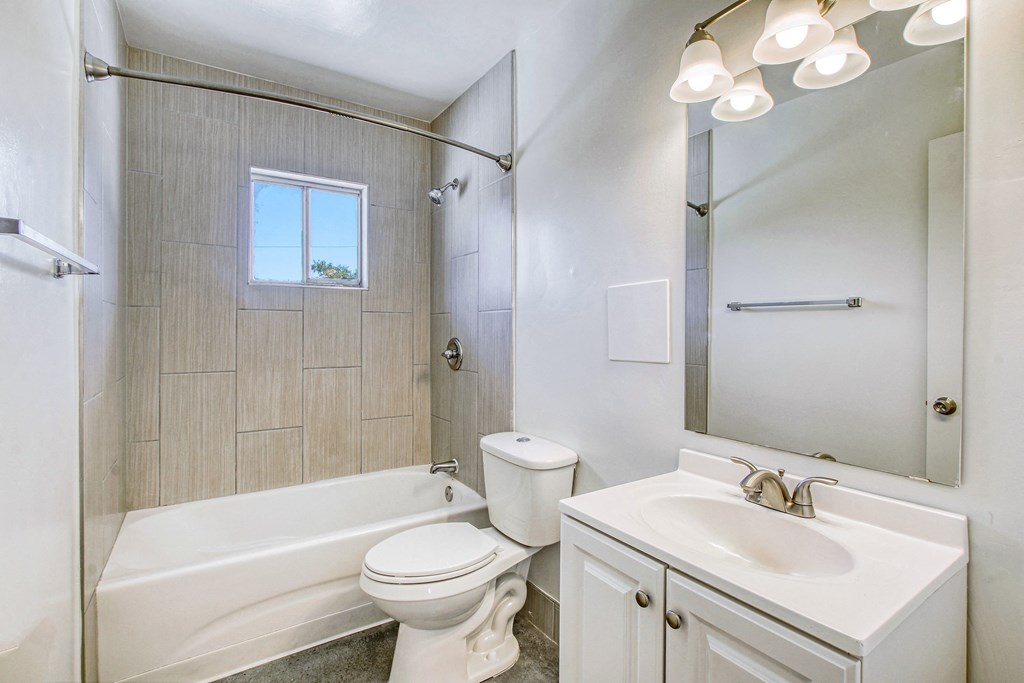a bathroom with a sink toilet and bathtub