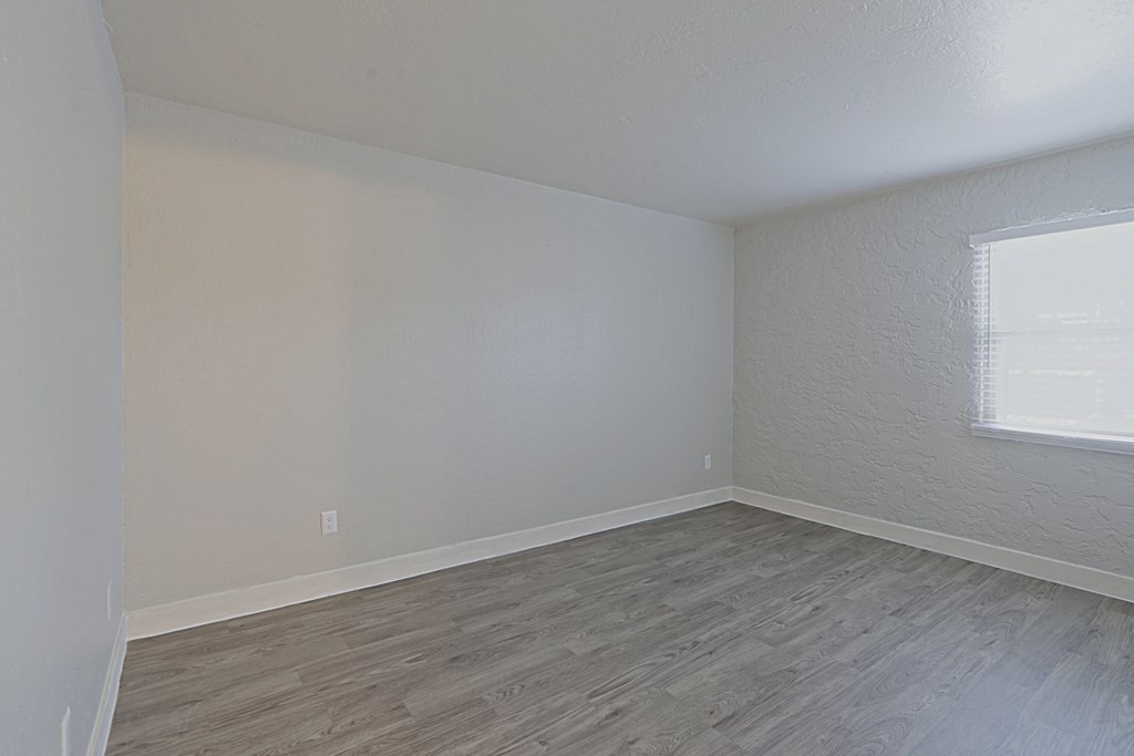 a bedroom with hardwood floors and a window at Allora Phoenix Apartments, Arizona, 85021