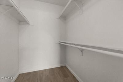 a white room with a white wall and a shelf on the wall